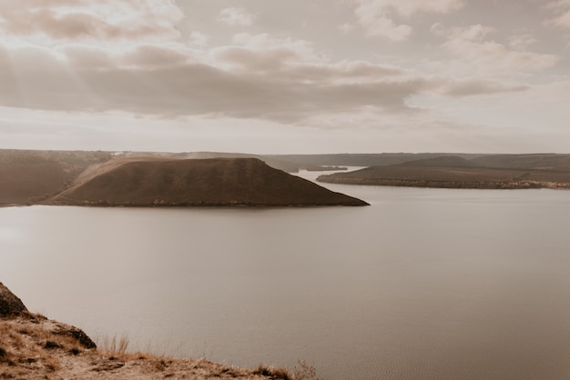 Panoramic view from the cliff to the big river lake sea in the distance silhouettes of the islands