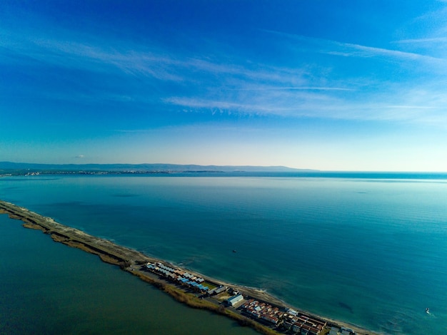 Panoramic view from a height above the town of Pomorie with houses and streets washed by the Black Sea in Bulgaria