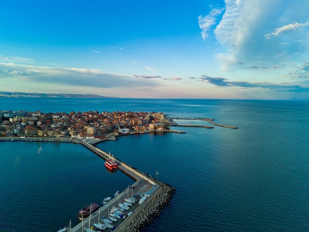 Panoramic view from a height above the town of Pomorie with houses and streets washed by the Black Sea in Bulgaria