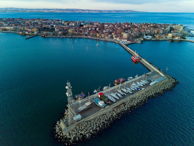 Panoramic view from a height above the town of Pomorie with houses and streets washed by the Black Sea in Bulgaria