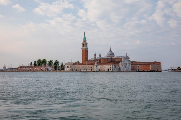 Panoramic view of Laguna Veneta of Venice city and away San Giorgio Maggiore Island. Landscape of summer morning day and dramatic blue sky