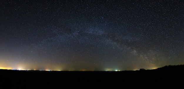 Panoramic view of the Milky Way Galaxy in the night sky with bright stars