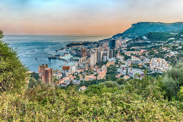 Panoramic view of Monaco at sunset from the Grande Corniche