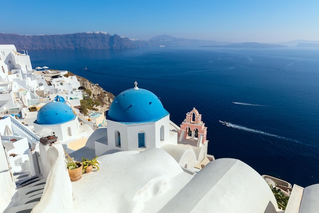 Panoramic view of Oia town cityscape at Santorini island in Greece Traditional white houses Greece Aegean sea Famous European destination