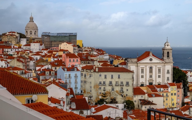 Panoramic view of the old town of Lisbon Portugal ocean in the background