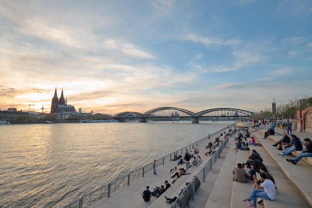 Panoramic view of the Rhine river at sunset as it passes through the city of Cologne in Germany