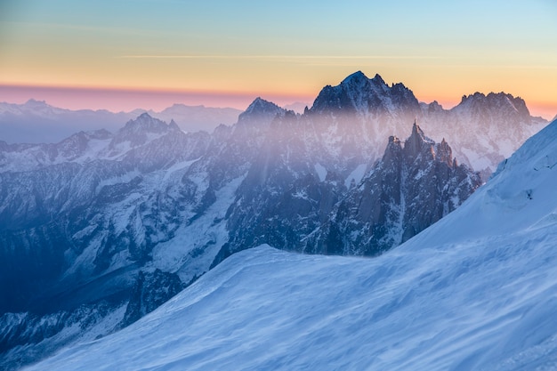 Panoramic view on rocky peaks of Aiguille du Midi at the sunrise. Chamonix, France. Scenic image of hiking concept. Perfect moment in alpine highlands.