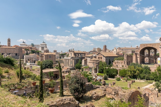 Panoramic view of Roman forum, also known by Forum Romanum or Foro Romano from Palatine Hill. It is a forum surrounded by ruins of ancient government buildings at center of city of Rome