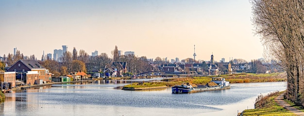 Panoramic view on Rotterdam-Overschie with on the background the skyline of Rotterdam