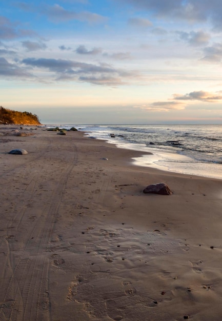 Panoramic view Rushing wave on a sunny day on the sandy beach of the Baltic Sea in Palanga Lithuania