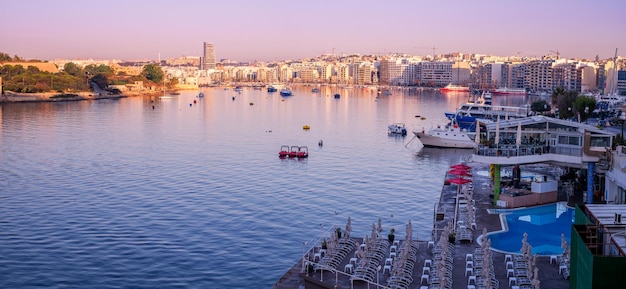 Panoramic view of the sliema city at sunset malta