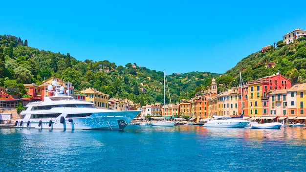 Panoramic view of small port with yachts and boats in Portofino town, Liguria, Italy