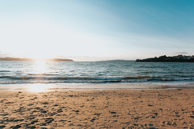 Panoramic view of a summer beach in spain during a sunset, copy space, minimal, clear sky