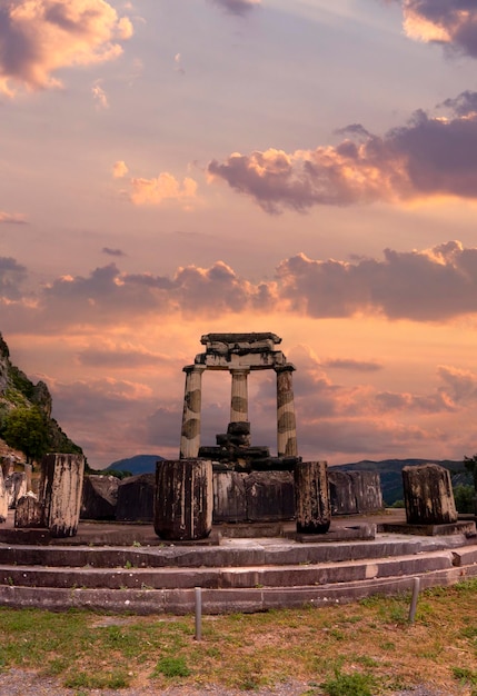 Panoramic view on Temple Athena Pronaia among the mountains in Delphi, Greece against at sunset