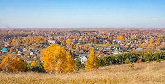 Panoramic view of the village of Srostki, Altai Republic, Russia. Sunny day in autumn