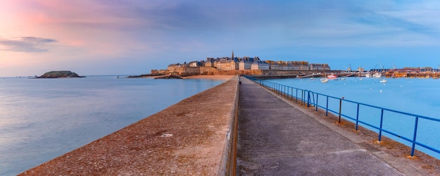 Panoramic view of walled city saintmalo with st vincent cathedral at sunset saintmaol is famous port