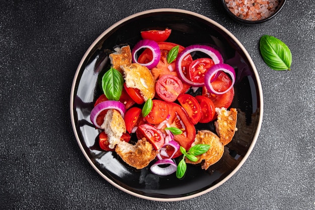 panzanella salad vegetables tomato, dried bread, onion healthy meal food snack diet on the table