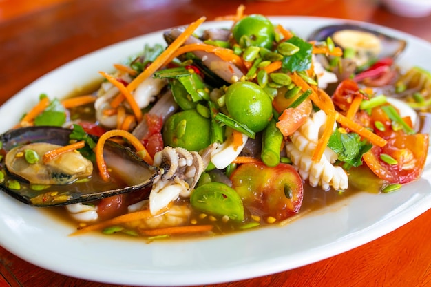 Papaya Salad (SomTam)with seafood,Thai food, spicy seafood salad.