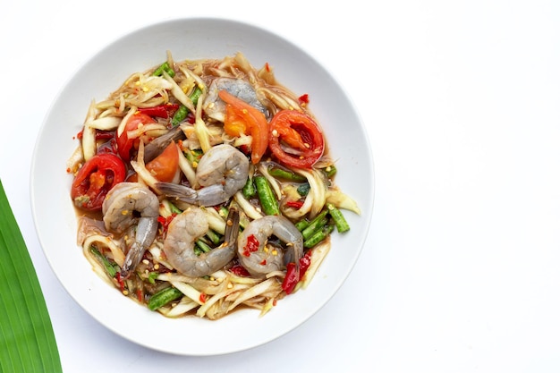 Papaya salad with shrimp in white plate