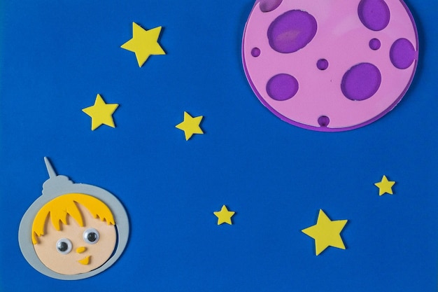 Paper applique on the theme of space with a man and stars