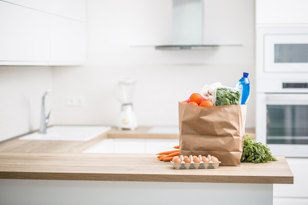 Paper bag with purchase on home kitchen.