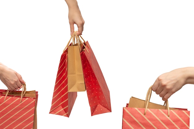 Paper bag in woman hands isolated on white background