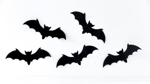 Paper bats hanging on wall