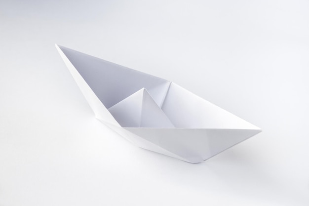 Paper boat origami isolated on a white background