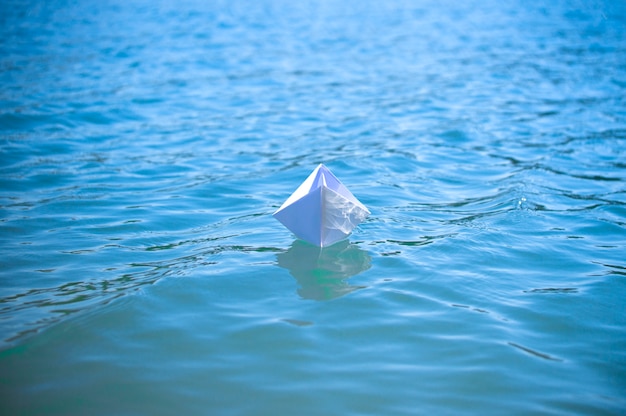 Paper boat in the water