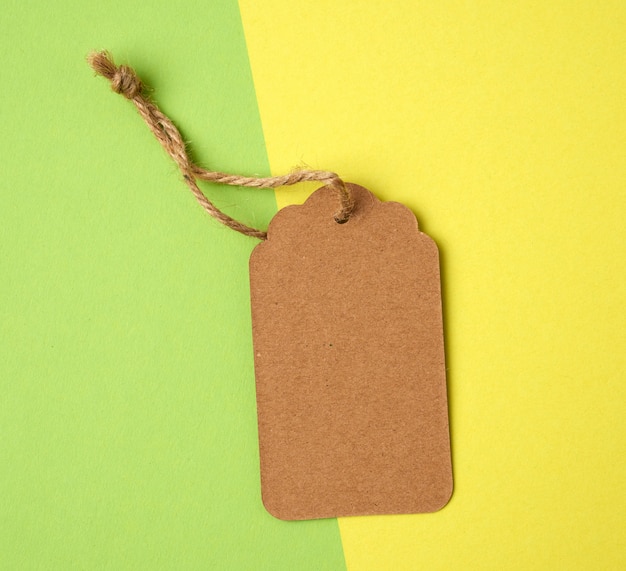 Paper brown rectangular price tag on a rope