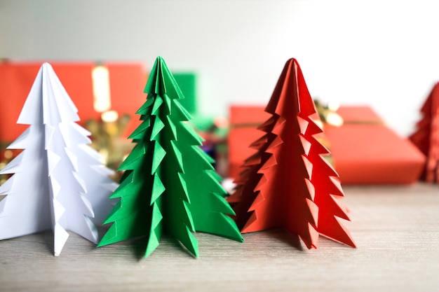 Paper Christmas season trees on white background. Cute little paper cut 