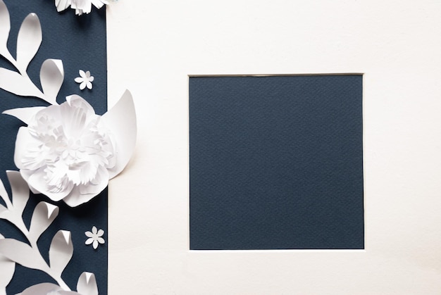 A paper cutout of a flower with a black background