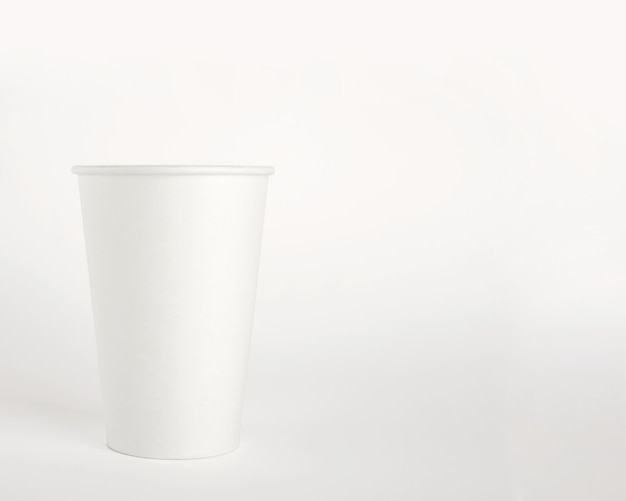 Paper disposable cup on white background Free space for your brand