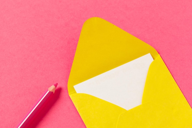 Paper envelopes on a colored pink background