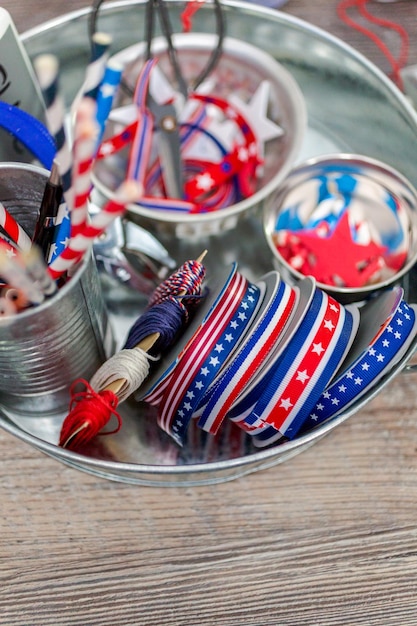 Paper firecrackers made from red, white and blue paper for July 4th celebration.