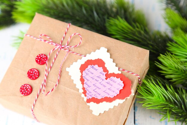 Paper gift box on wooden background