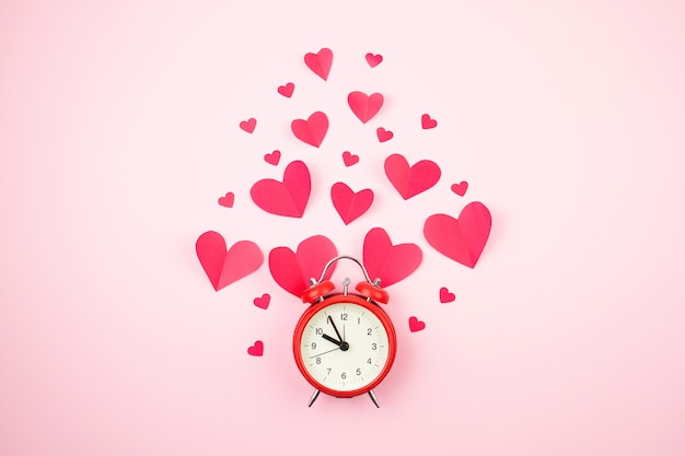 Paper hearts and alarm clock. 