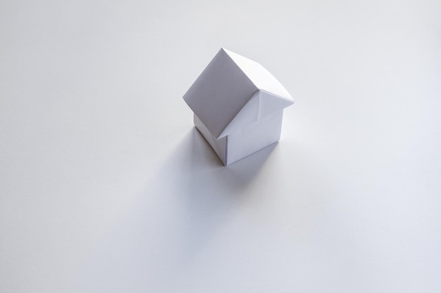 Paper house origami isolated on a white background