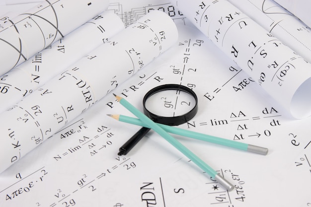 Paper math electrical formulas, magnifier and pencils