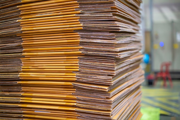 Paper pile and piece of cardboard at the recycle