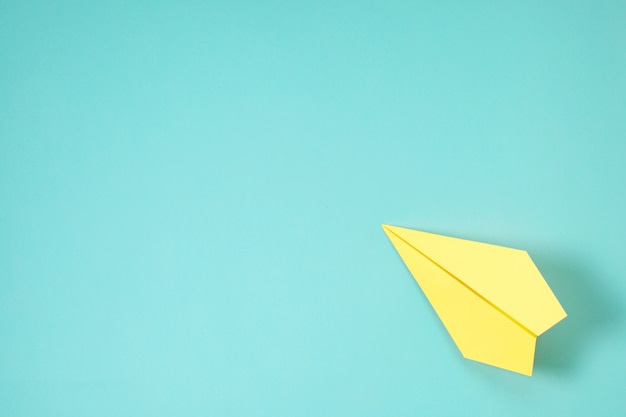 Paper plane on blue background