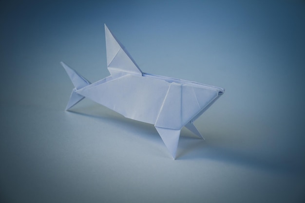 Paper shark origami isolated on blank background