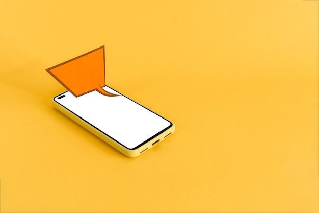 Paper speech bubble and smart phone with blank screen on yellow background Isometric view Communication and chat concept