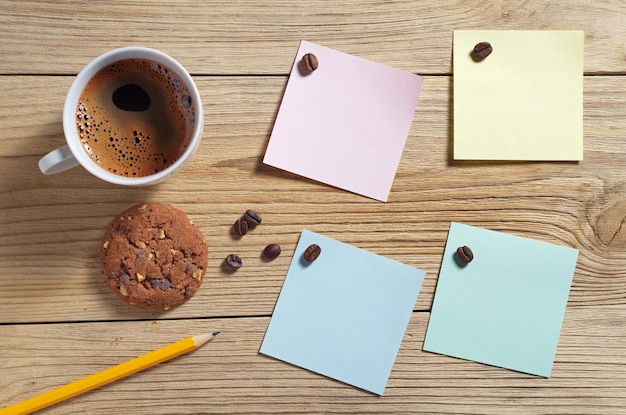 Paper sticky notes and coffee