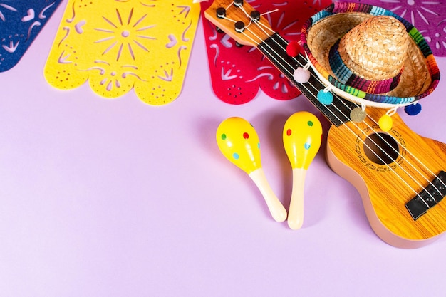 Paper traditional banner flag mexican hat guitar and maracas Happy Cinco de Mayo