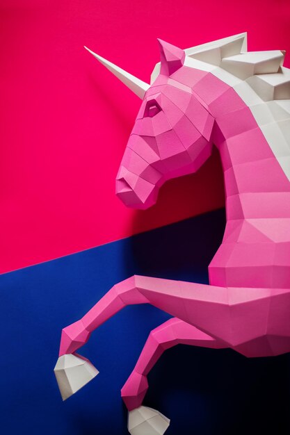 Paper unicorn head on a colored background