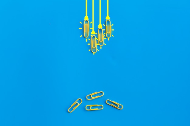 paperclips on blue background