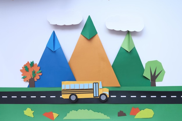 Papercraft Mountain Landscape With Colorful Tree And School Bus