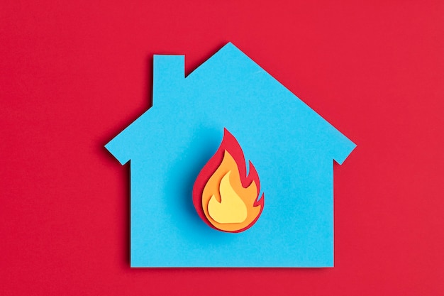 Photo papercut house with fire inside burnout, psychology, stress, mental illness concept