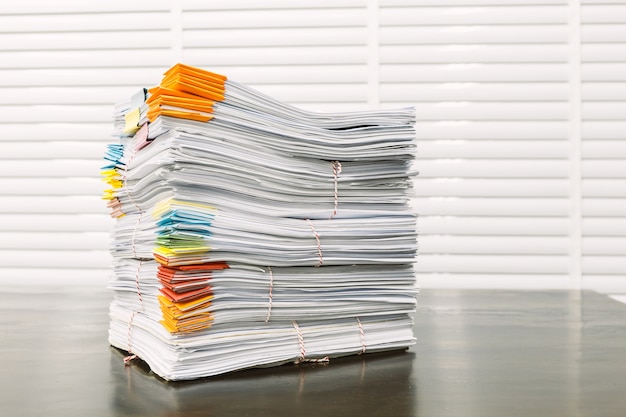 Paperwork pile print document unorganized put on the desk